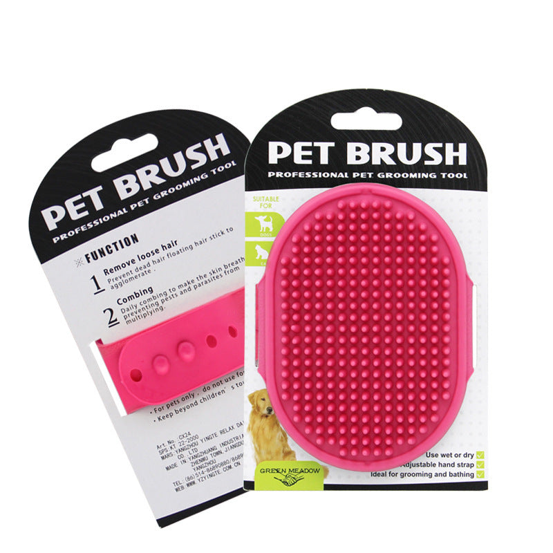 Pink pet brush with packaging on a white background