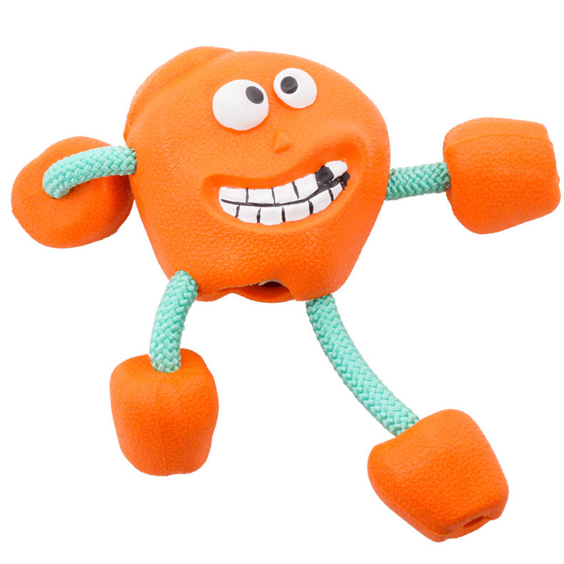Orange dog toy with a face and green legs on a white background