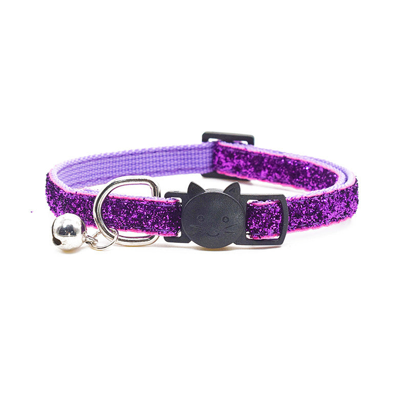 Purple glitter cat collar with a bell on a white background