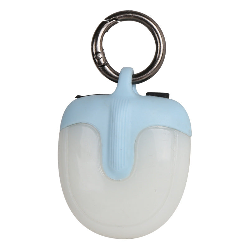 Light blue and white device with a keyring on a white background