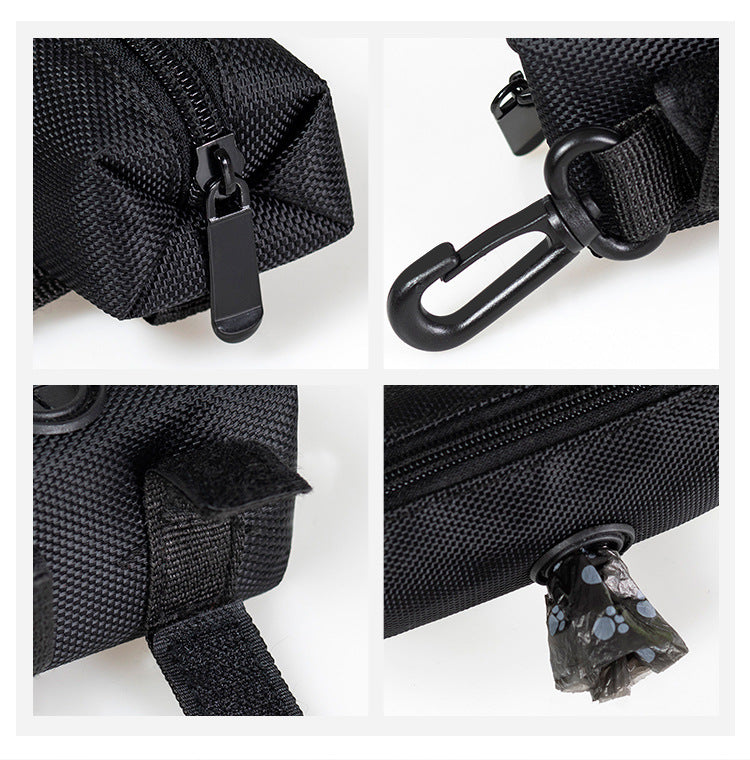 Close-up details of a black bag with zippers, carabiner, and strap on a white background.