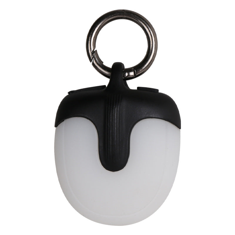Black and white keychain light with a ring on a white background