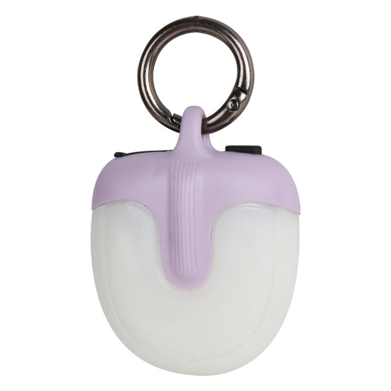 White LED keychain light with purple accent and metal ring on a white background