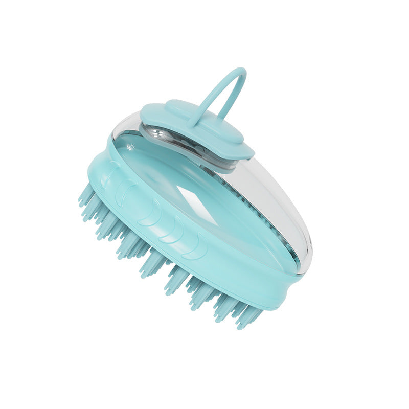 Turquoise pet bath brush massager on a white background