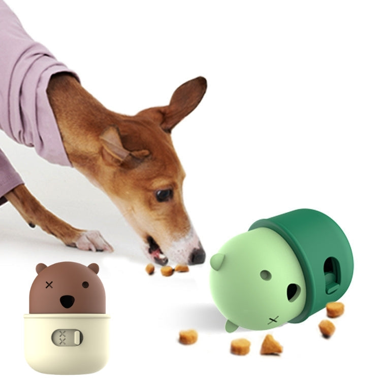 Two animal-shaped food leakage devices with a dog sniffing at them.