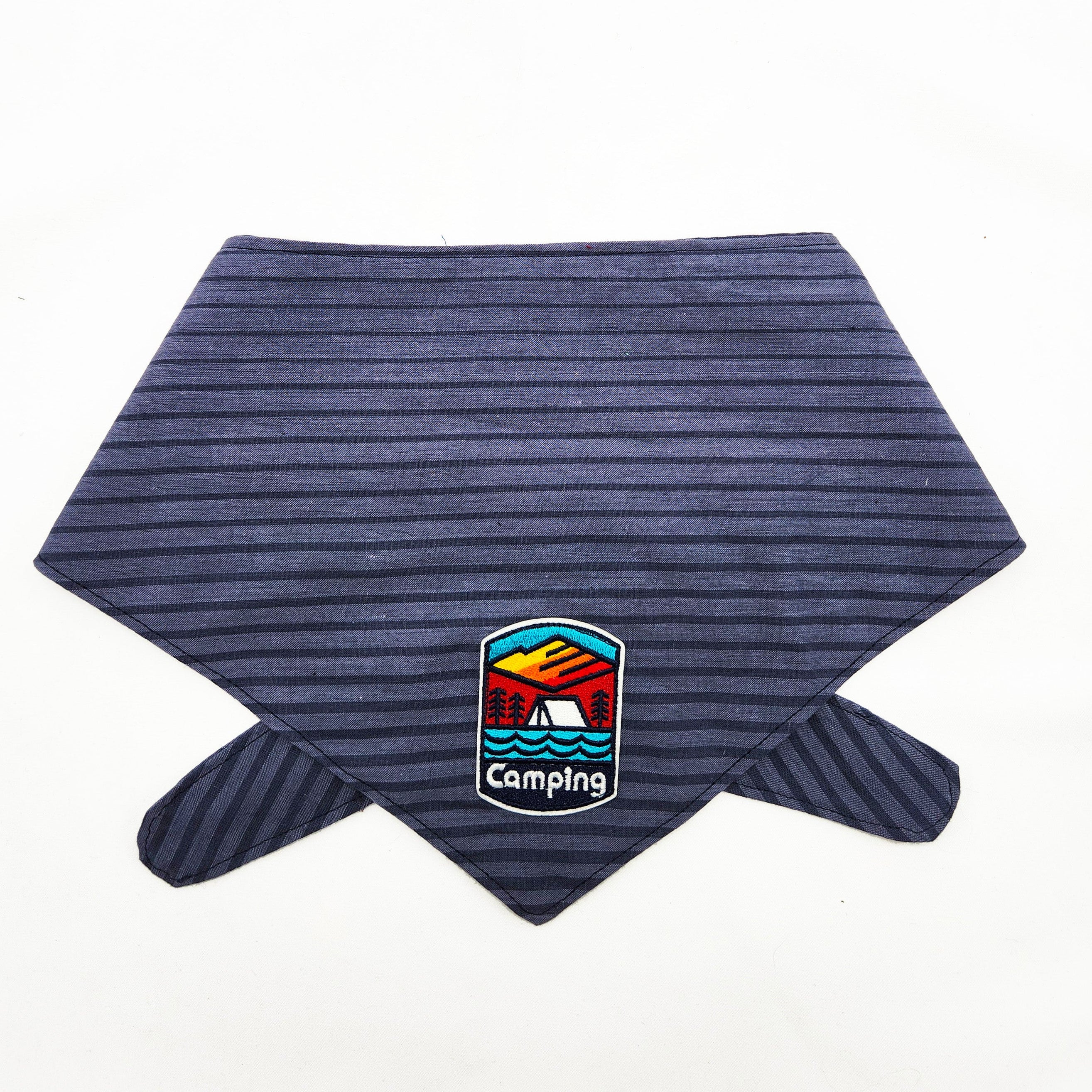 Blue striped bandana with a camping-themed patch on a white background