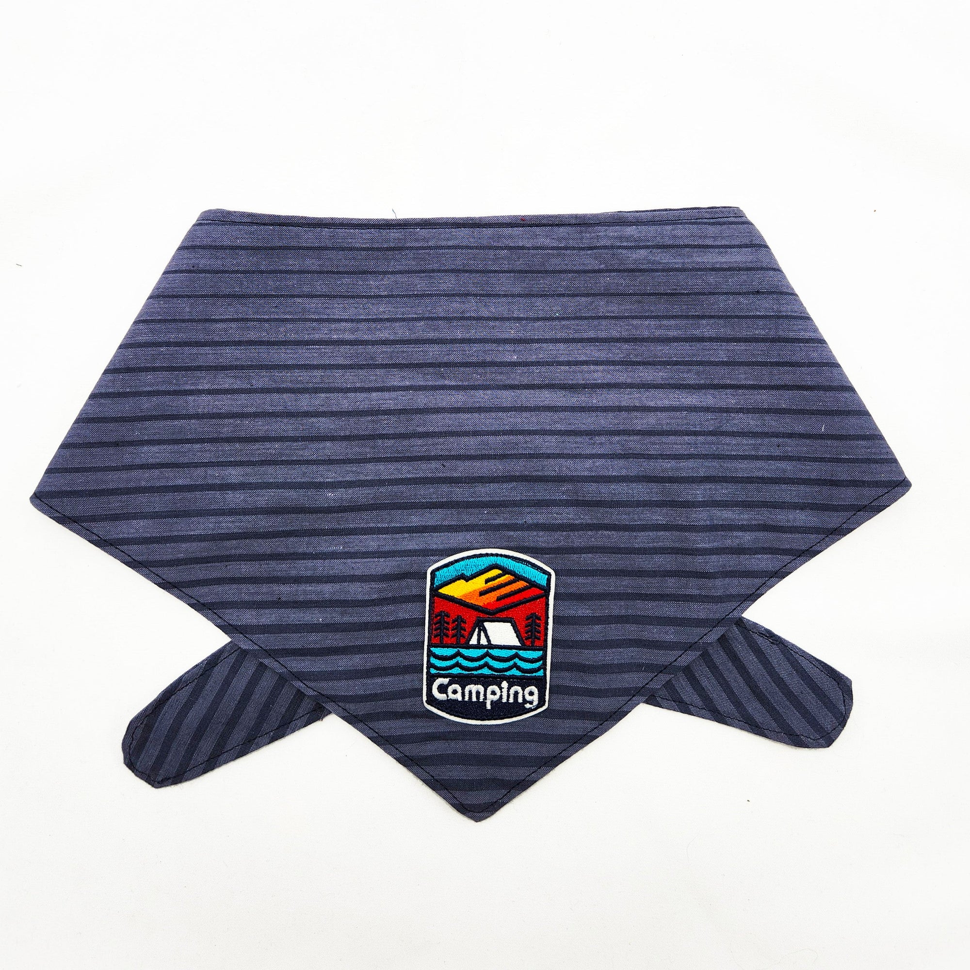 Blue striped bandana with a camping-themed patch on a white background