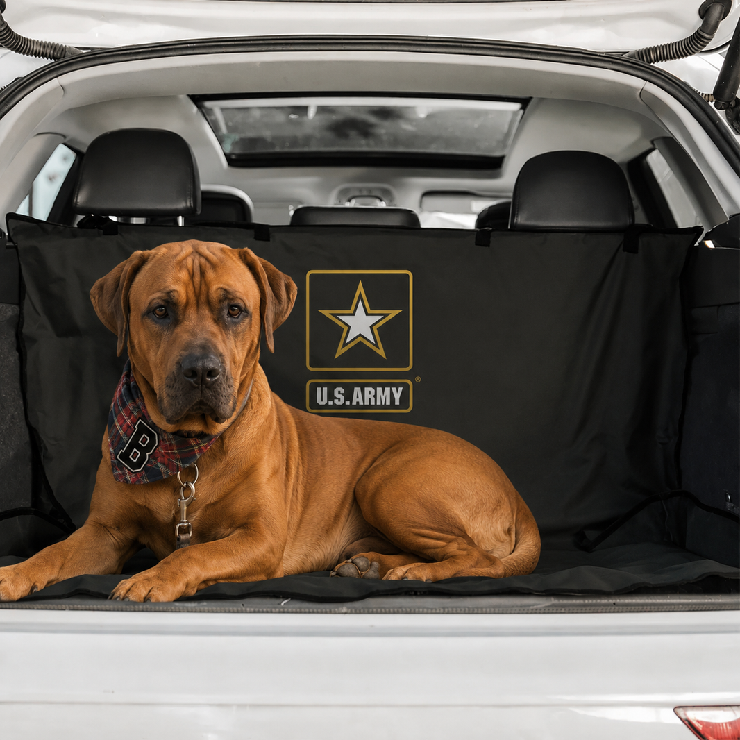 Dog sitting on a U.S. Army branded car mat in a vehicle.