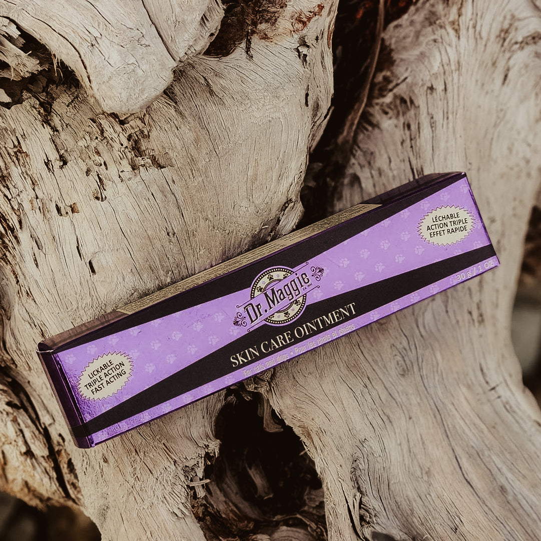 Box of Dr. Maggie Skin Care Ointment on a wooden surface