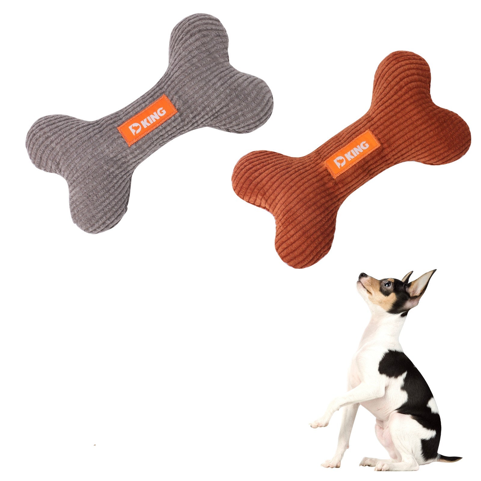 Three bone-shaped dog toys in gray, brown, and red with a dog sitting next to them on a white background.