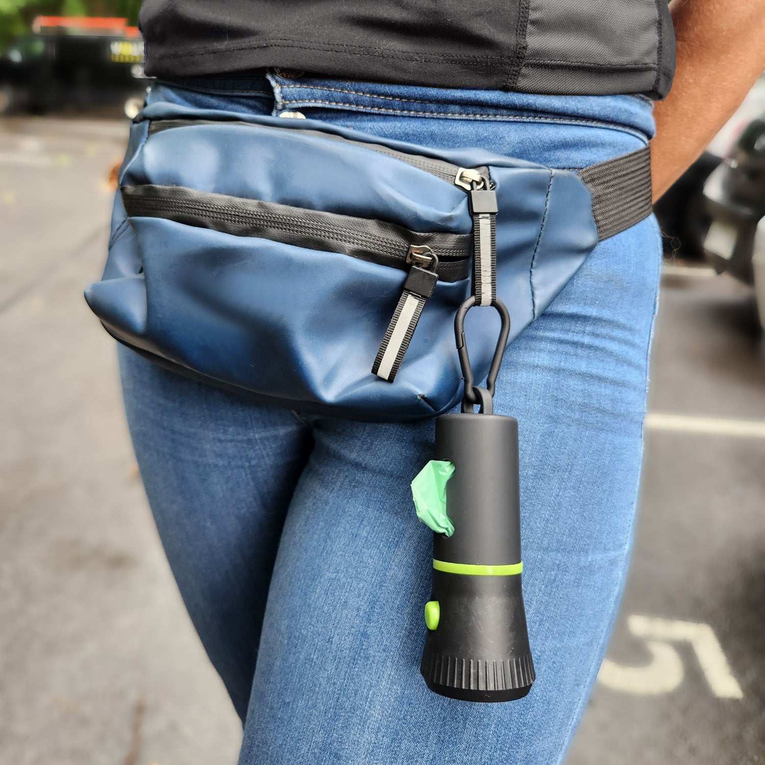 Poop bag dispenser attached to waist bag