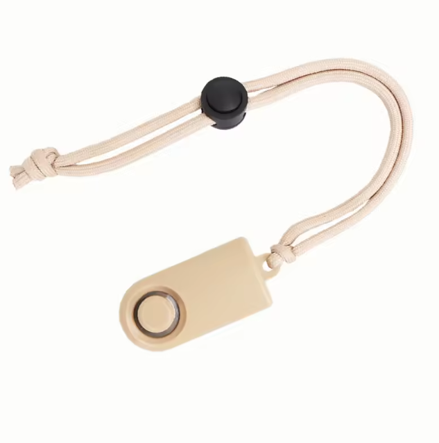 A beige plastic personal training clicker with a matching beige cord and black button, shown on a plain white background.
