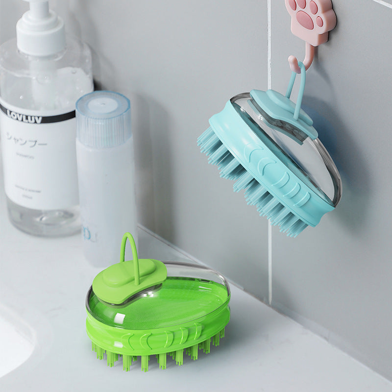 Two green and blue scrubbing brushes hanging on a gray wall with bottles in the background.