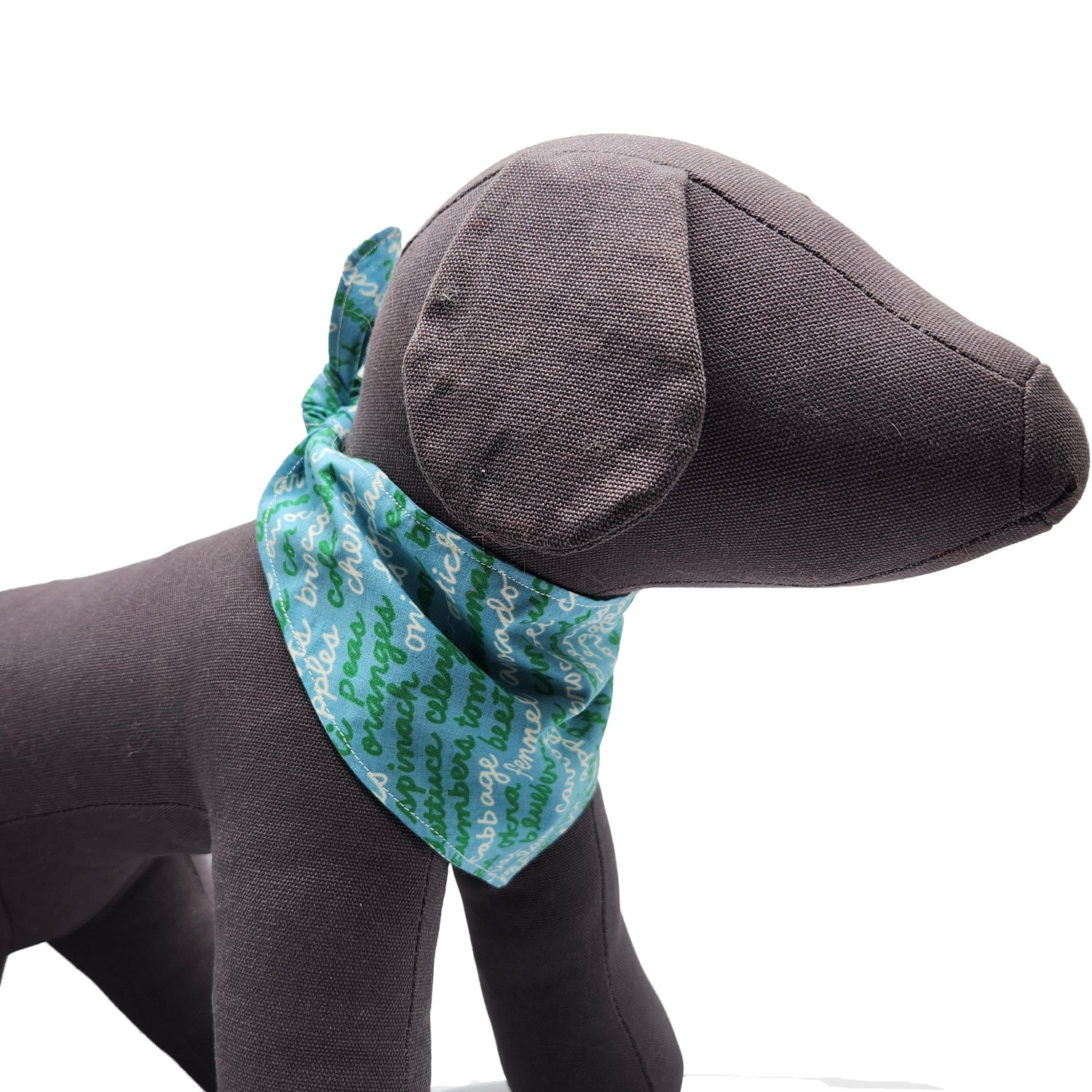 Gray dog toy with a blue bandana featuring green text on a white background