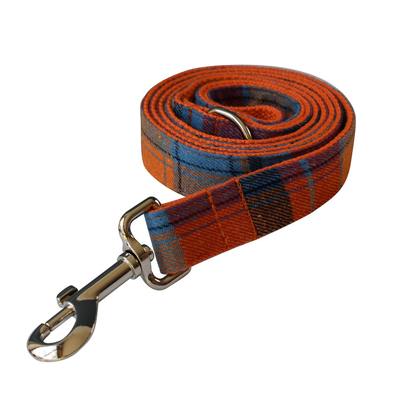 Plaid dog leash with metal clip on a white background