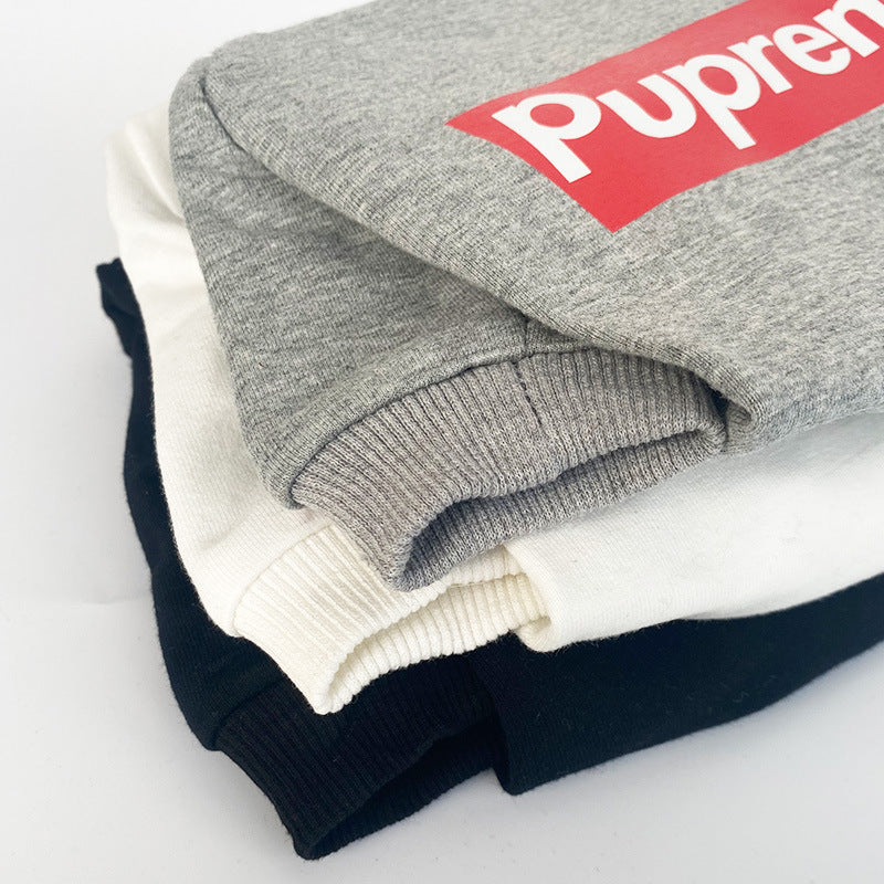 Stack of folded dog fleece 
with a visible brand logo on a light background