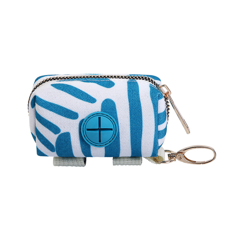 Blue and white patterned poop bag dispenser with a central circular design on a white background