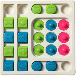 Colorful puzzle toy with green, blue, and pink shapes on a white background