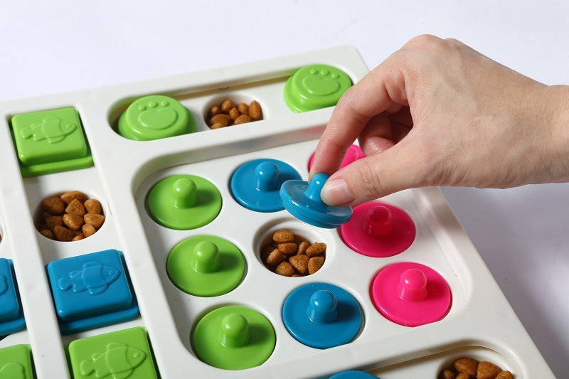 Colorful pet puzzle toy with a hand interacting with it