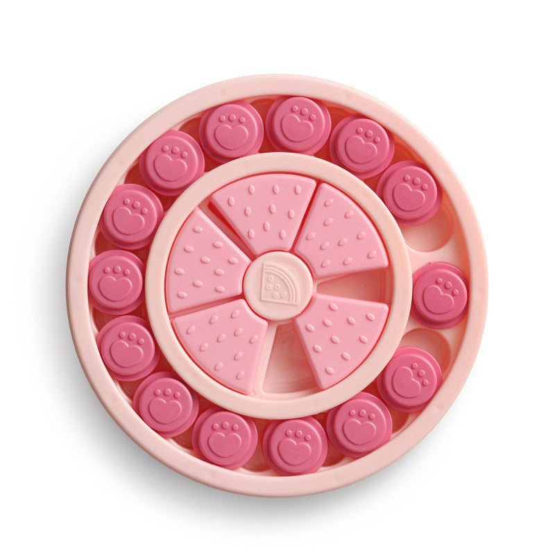 Pink pet toy with smiley face and paw print designs on a white background