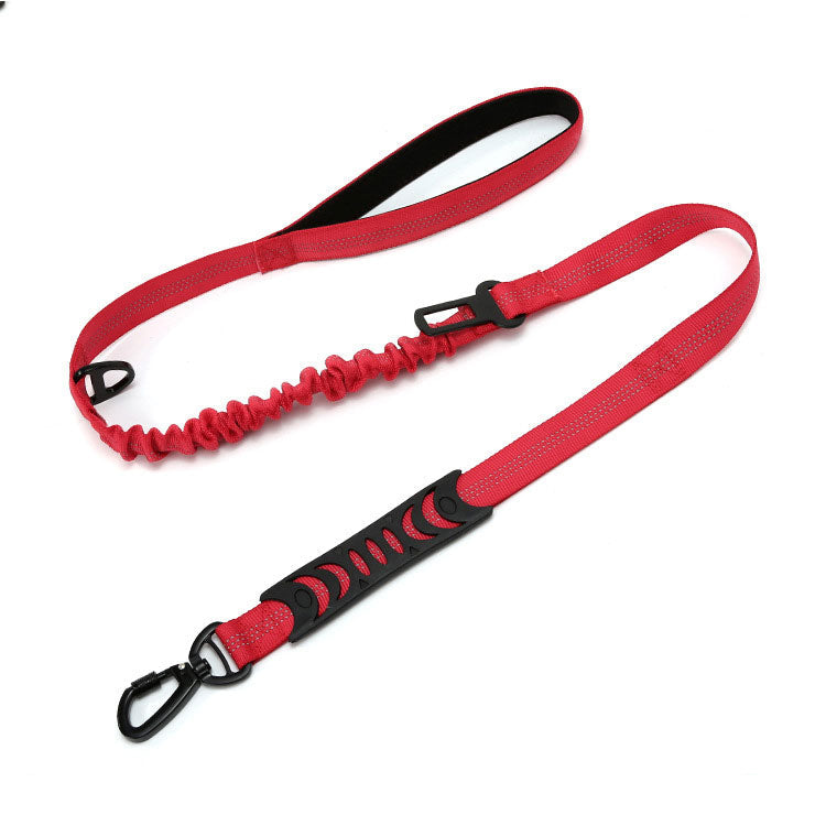 Red and black dog leash with bungee feature on a white background